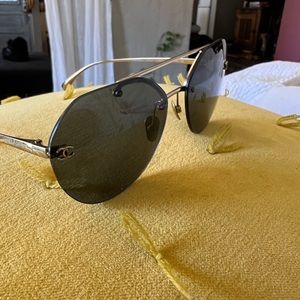 Chanel Sunglasses. Black lens. Gold frame.